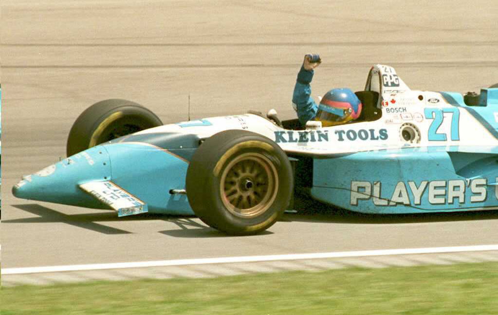 Canadian Indy car driver Jacques Villeneuve pumps